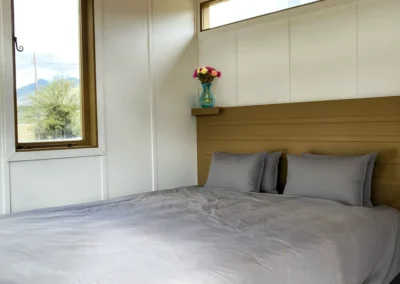 Double bed with warm natural light.
