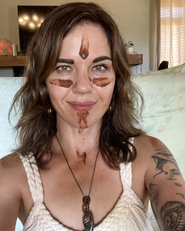 Letitia 1 Letitia during her cacao initiation ceremony, adorned with sacred Cacao markings on her face — a moment of deep reverence, embodiment, and connection to the Spirit of Cacao.
